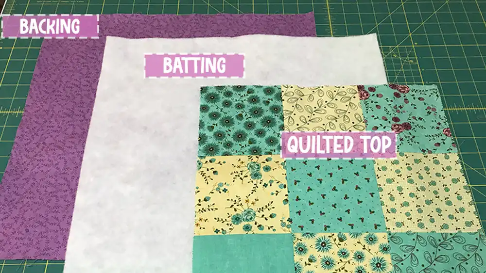 how to layer the quilt top batting and backing