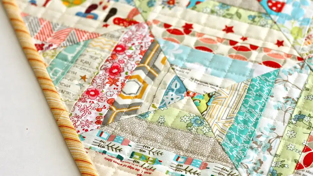 quilt made from scraps of fabric sewn together