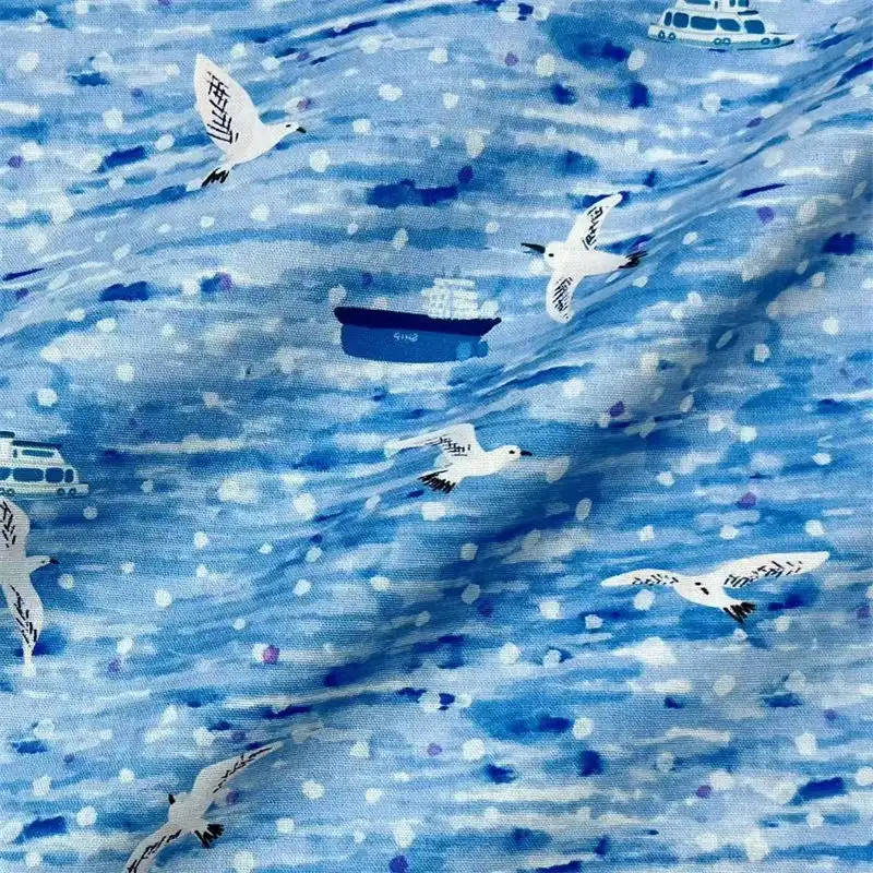 Ocean blue cotton plain fabric with seagulls and boats