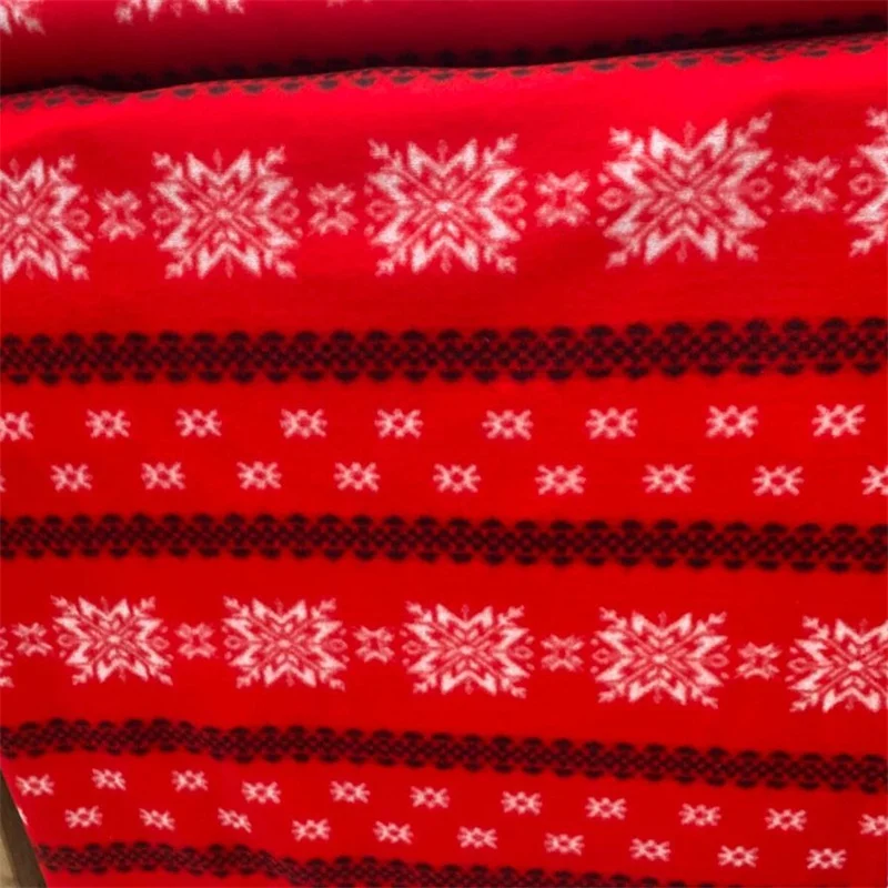 snowflakes Christmas holiday fleece fabric on red