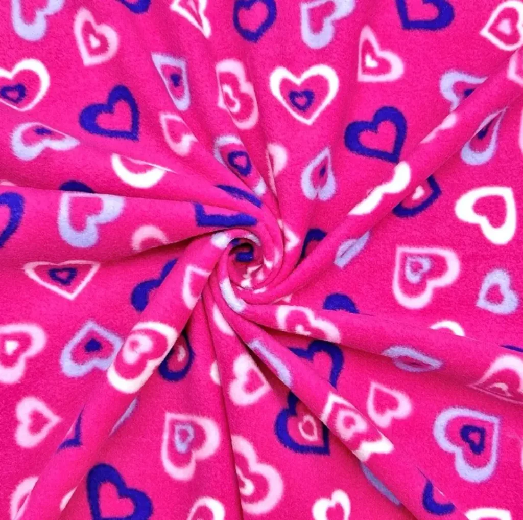 white and blue hearts on pink fleece fabric