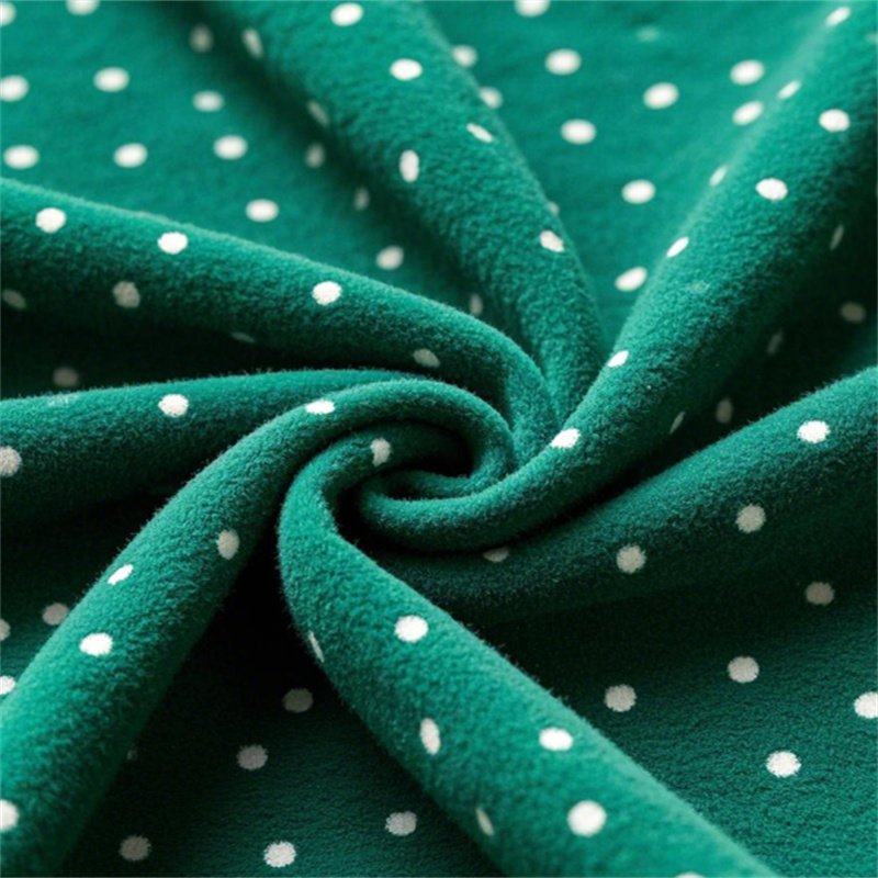 Dotted Green Polar Fleece fabric