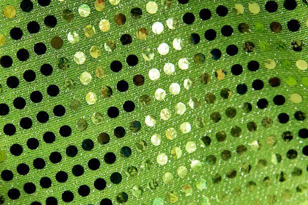 Holiday decorations green sequin fabric background