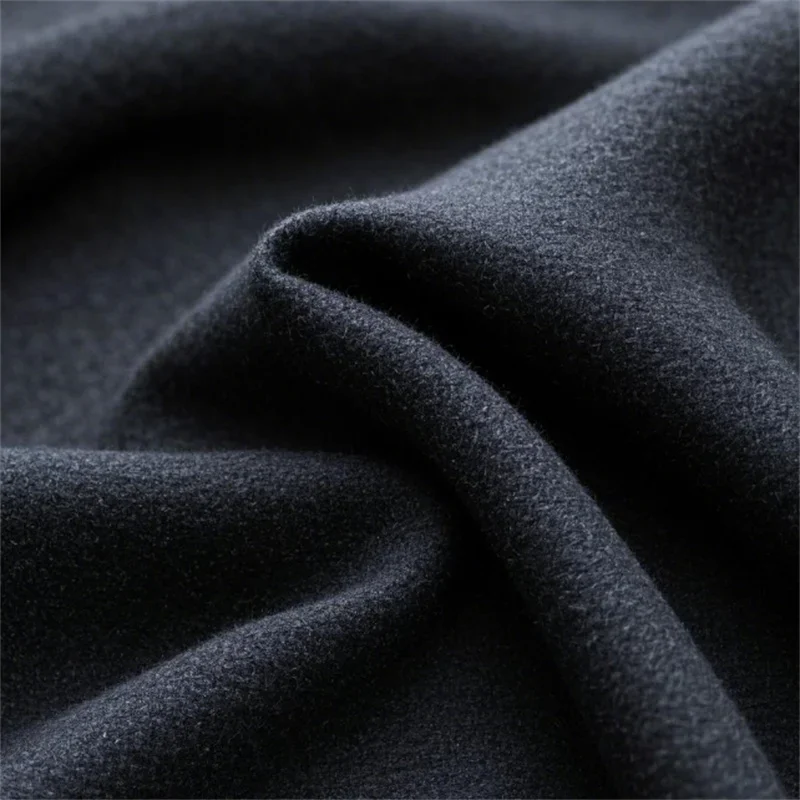 Subtle Flecked Design Adding Texture to Black Sweatshirt Fleece Fabric Subtle Flecked Design Adding Texture to Black Sweatshirt Fleece Fabric